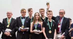 Squeezed in Three Suits by Brian Senior