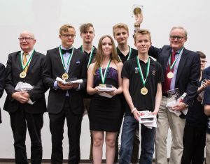 Squeezed in Three Suits by Brian Senior