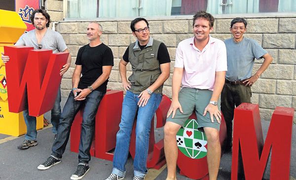 The Double Dummy production team poses outside the playing site in Taicang, China. From left are Derek Sieg, producer; Darin Moran, director of photography; Lucas Krost, director; John McAllister, producer; and Liming Fan, sound man.